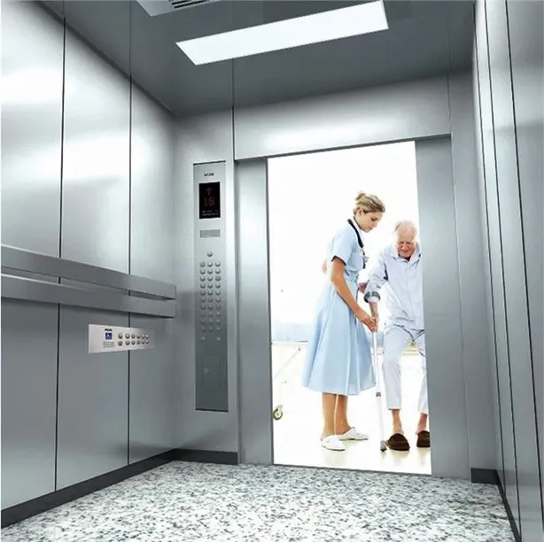 A nurse is helping a patient to enter into a elevator in a hospital